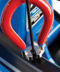 Four Sided Spoke Wrench For Nipples 3.23 Millimeter 0.13 Inch Red Wheel Truing Tool in use on bicycle rim