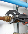 Cobra Water Pump Pliers, 10 Inch, with adjustable jaw and self locking grip on pipe fitting, showing quick fine adjustment feature