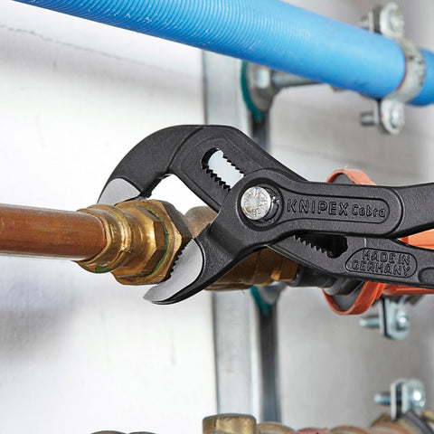 Cobra Water Pump Pliers, 10 Inch, with adjustable jaw and self locking grip on pipe fitting, showing quick fine adjustment feature