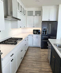 Modern kitchen with cabinetry featuring Door And Drawer Pulls 6-Inch Center-To-Center Brushed Titanium Gold Finish 10 Pack For Cabinets And Furniture Upgrades Ideal For Kitchens And Bathrooms Includes Ten Pulls For Easy Replacement And Coordinating Hardware With Matching Lexington Knobs.