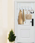Over The Door Hook Rack With 5 Tri Hooks For Coats And Towels, White Finish on door, holding coat, bag, headphones.