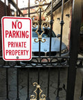 Tough As Nails No Parking Private Property Sign 12 X 18 Inch Heavy Duty Aluminum Sheet mounted on a gate with a parked car behind it.