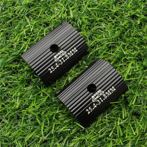 Black Bike Handlebar Shim Set 25.4 To 31.8 Mm Aluminum Alloy Stem Reducer Clamp on grass background