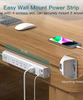 Two Pack Heavy Duty Surge Protector Power Strip With Six Foot Extension Cord Five Wide Spaced Outlets And Four Usb Charging Ports For A Hassle Free Tech Setup That Actually Holds Up mounted on a wooden desk.