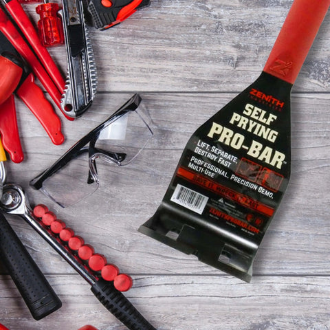 Self Prying Pro Bar Salvage Wrecking And Demolition Tool with black steel body and red handle on wood background.
