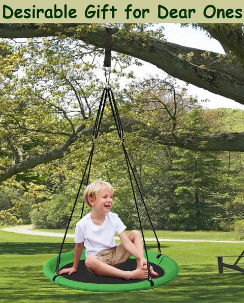 Child sitting on green 24 Inch Saucer Tree Swing Set For Kids And Adults, Adjustable Backyard Swing under a tree.