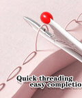 Close-up of 2 In 1 Automatic Needle Threader And Seam Ripper For Quick Sewing And Quilting Projects showing needle threading on fabric