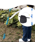 Person using Spreader Backpack Sprayer For Granular Manure And Fertilizer with Easy Grip PVC Handle in a garden.