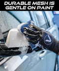 Person using Mesh Bug Scrub Sponge For Cars 4x6 Inch, Tar And Bug Remover, Microfiber Mesh With Foam Core on car side mirror