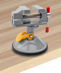 Mini Bench Vise With 360 Degree Swivel Suction Base Small Table Clamp on wood surface