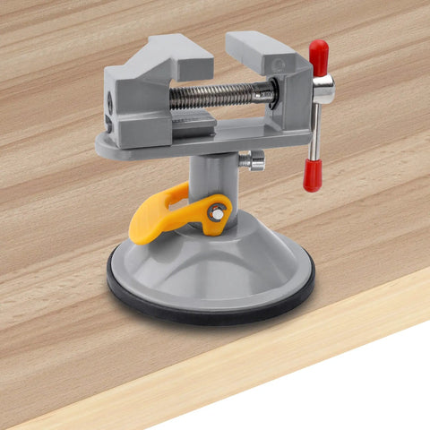 Mini Bench Vise With 360 Degree Swivel Suction Base Small Table Clamp on wood surface