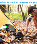 Man securing a tent with Beefy Heavy Duty Metal Tent Stakes Set 17 Pack for Outdoor Decorations on forest ground.
