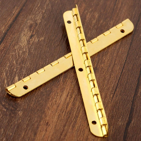Antique Bronze Decorative Hinges for Wooden Boxes and Cabinets 2 Pack Butt Hinges 100mm by 9mm on a wooden surface