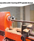 Heavy Duty 3 Inch Steel Wood Lathe Faceplate With 1 Inch By 8 Tpi Thread installed on lathe with wood shavings