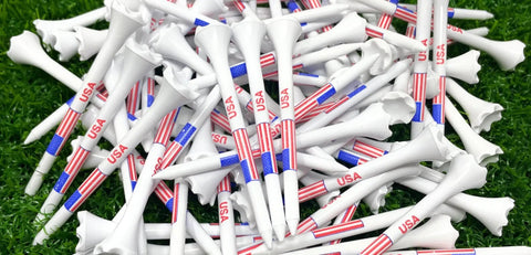 Pile of 3 1/4 Inch American Flag Plastic Golf Tees Pack Of 100 Patriotic Bulk Tees With 6 Prong Cup To Reduce Ball Contact.