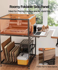 Laser Engraver Enclosure Cabinet With Exhaust And Ventilation Fan in use, side view showing foldable panel and storage space.