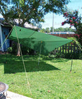 Adjustable Portable Tent Poles 74.8 Inches Beefy Rustproof Thickened Iron Stakes For Camping Hiking Van Awnings Beach Tents With Storage Bag 2 Pack Black set up with green tarp in a garden setting