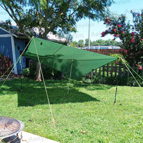 Adjustable Portable Tent Poles 74.8 Inches Beefy Rustproof Thickened Iron Stakes For Camping Hiking Van Awnings Beach Tents With Storage Bag 2 Pack Black set up with green tarp in a garden setting