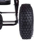 Close-up of Red Pro Grade Heavy-Duty 100 Lb Broadcast Fertilizer Spreader's 13-inch pneumatic tire and frame