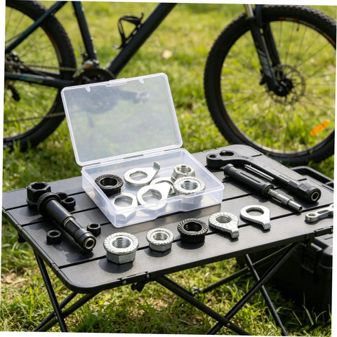 Beefed Up Heavy Duty Bicycle Wheel Axle Nut Kit With Carbon Steel Nuts And Anti Rotation Tab Washers For Mountain And Road Bikes Secure Retention Hardware To Prevent Loosening During Rough Rides. Wheel axle nut kit in case with carbon steel nuts and tab washers on a table.