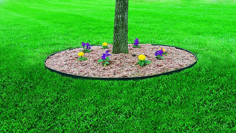 Tree surrounded by No Dig Landscape Edging Kit, 100 Ft Flexible Black Border with 32 anchoring spikes used for garden space