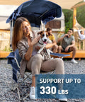 Woman sitting on Beach Chair With Canopy Shade Foldable Camping Chair With Cup Holder And Side Pocket For Beach And Camp Tailgating