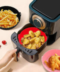 Reusable Silicone Air Fryer Liners Set Of 3, 8.5 Inch Round Basket Liners with cooked food in air fryer