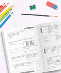 Common Core Math 4 Today 3rd Grade Workbook For Daily Practice In Class Or Homeschool open on desk with pencils, brush, eraser, sharpener.