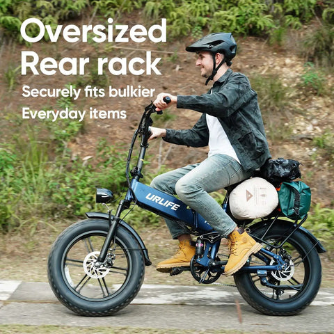 Man riding Folding Fat Tire Electric Bike for Adults With 1500W Peak Motor, 60 to 80 Mile Range, 48V 13Ah Battery, Klein Blue, on path