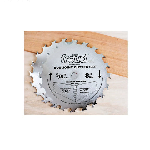 8 Inch Box Joint Cutter Set With Hi Density Carbide Blades For Crisp Square Joints On Your Table Saw Includes Two Spare Blades 1/4 And 3/8 Inch Grooves 5/8 Shank Anti Kickback Design A Total Shop Workhorse For Smooth Cuts Daily saw blade on wood, showing diameter and groove details.