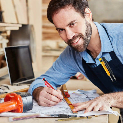 Man using Pro Grade Mechanical Carpenter Pencil Set With Built In Sharpener, 18 Refills, Automatic Center Punch And Carbide Scriber