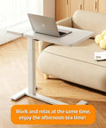 Stylish Electric Height Adjustable Mobile Overbed Side Table With Quiet Lifting Motor, Digital LED Display, Hidden Rolling Wheels, And Sleek Design For Ultimate Comfort And Versatile Usage In Any Bedroom Or Home Office Setup Today, featuring a laptop on white surface.
