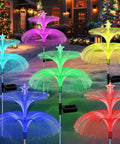 Solar Star Jellyfish Garden Lights Six Pack With Color Changing Fiber Optic Glow in vibrant colors outdoors at night