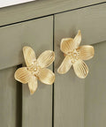 8 Pack 2.4 Inch Brushed Gold Flower Cabinet Knobs With Three Screw Sizes, Vintage Floral Drawer Pulls installed on green cabinet