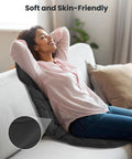 Woman using Back Massager With Heat And Vibration, Seat Cushion With 8 Massage Nodes And 5 Modes, relaxing on couch.