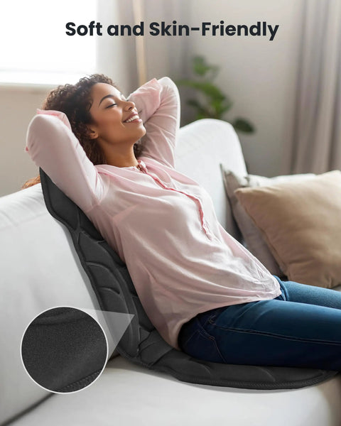 Woman using Back Massager With Heat And Vibration, Seat Cushion With 8 Massage Nodes And 5 Modes, relaxing on couch.