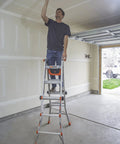 Man uses Cargo Hold Ladder Accessory Fabric Tool Pouch for multi-position ladders, attached on garage ladder