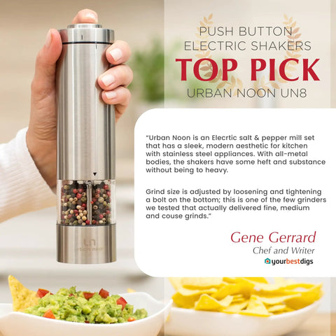 Battery Operated Salt And Pepper Grinder Set With Light Stainless Steel Mills Two Piece Auto One Handed Operation Electronic Adjustable Shakers Ceramic Grinders Rustproof Core For Smooth Grinds And Sleek Kitchen Style in hand next to guacamole