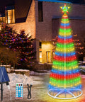 Outdoor LED Christmas tree with multicolored lights, solar panel, and remote, showcasing festive garden decoration at night.