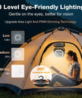 Portable Camping Fan With 20000mAh Battery Remote And Led Lantern inside illuminated tent with woman reading
