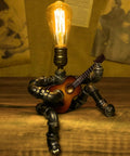 Steampunk Guitar Table Lamp For Music Lovers with robot design, industrial pipe structure, and Edison bulb, retro metal decor