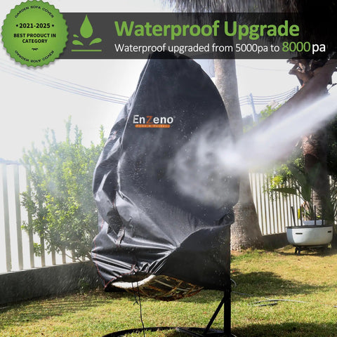Waterproof Egg Chair Cover For Patio With Zipper 75x45 Inch in garden with water spray demonstrating weatherproof feature.