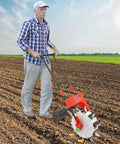 Man using 10 Nozzles Hand Push Seeder Pro Grade For Precision Planting And Fertilizer Application Metal Walk Behind Garden Seeder