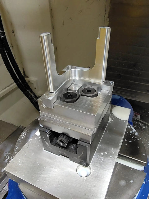 Hexagonal Side Fixed Fixture for CNC Machining Centers, Beefy Small Precision Clamping Block, Multi Station OK Fixture, Pro Grade Hardened 45 Steel, M6 Thread, 16mm Wide by 5.5mm High, Centered Hole, Edge Clearance, 10 Pack on CNC table