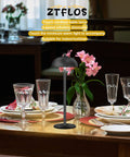 Cordless Table Lamp With 5200mAh Battery, LED Portable Touch Desk Light, on a restaurant table setting with flowers and glasses.