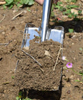 Stainless Steel Garden Trowel Hand Shovel for Planting, Transplanting, and Weeding, shown digging soil in a garden bed