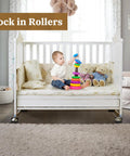 Non Slip Rubber Furniture Caster Cups Three Inch By Three Inch Square Black Floor Protectors on crib wheels, wooden floor.