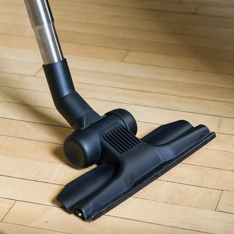Universal 30 Ft Central Vacuum Kit With Suction Driven Turbo Nozzles For Versatile Cleaning On Hard Floors, close-up on hardwood floor.