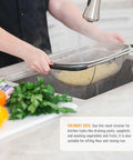 Person using 6-Quart Over The Sink Stainless Steel Colander With Expandable Rubber Handles to drain pasta over kitchen sink