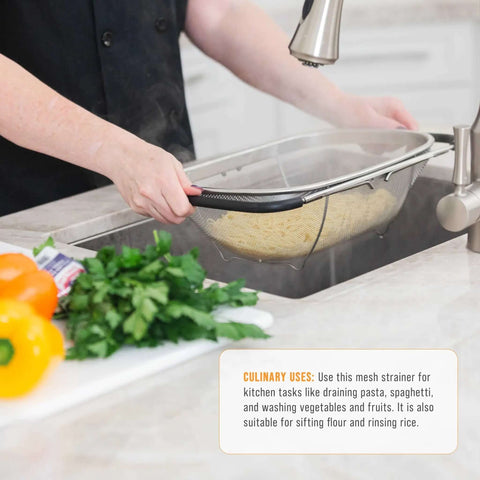 Person using 6-Quart Over The Sink Stainless Steel Colander With Expandable Rubber Handles to drain pasta over kitchen sink
